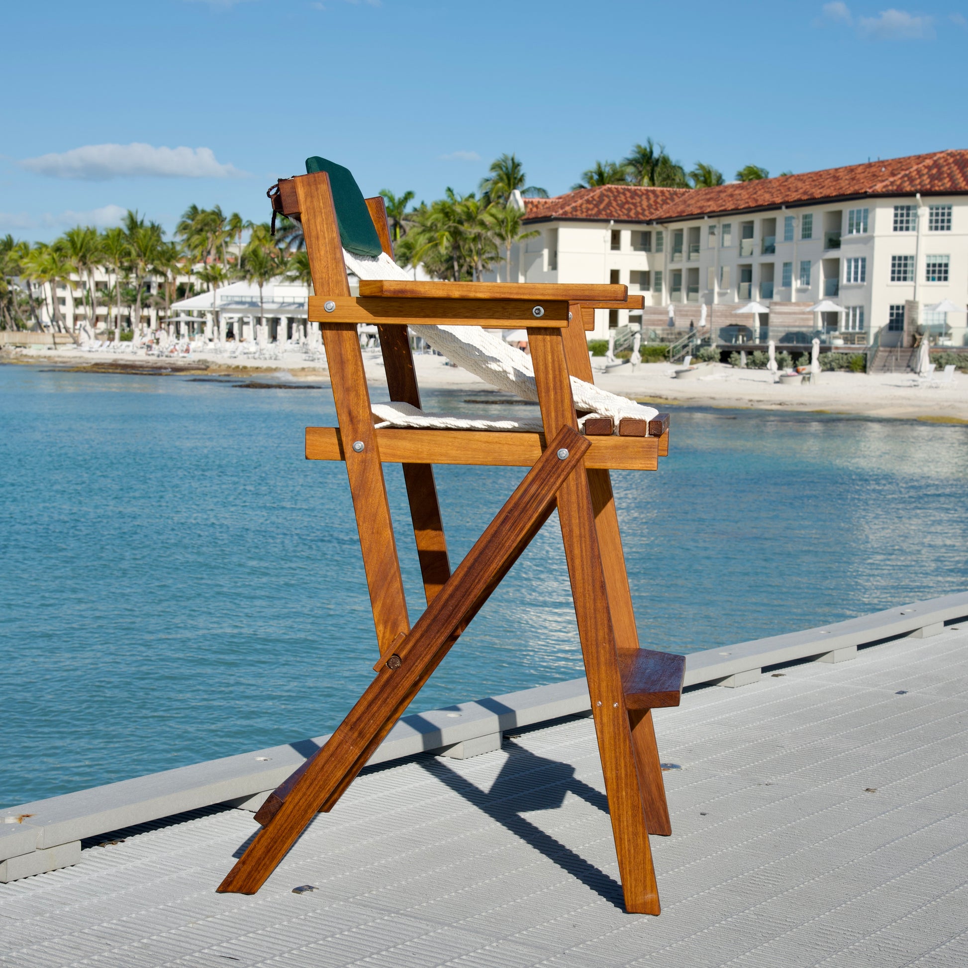 bar stool on a dock overlooking the ocean on a sunny day