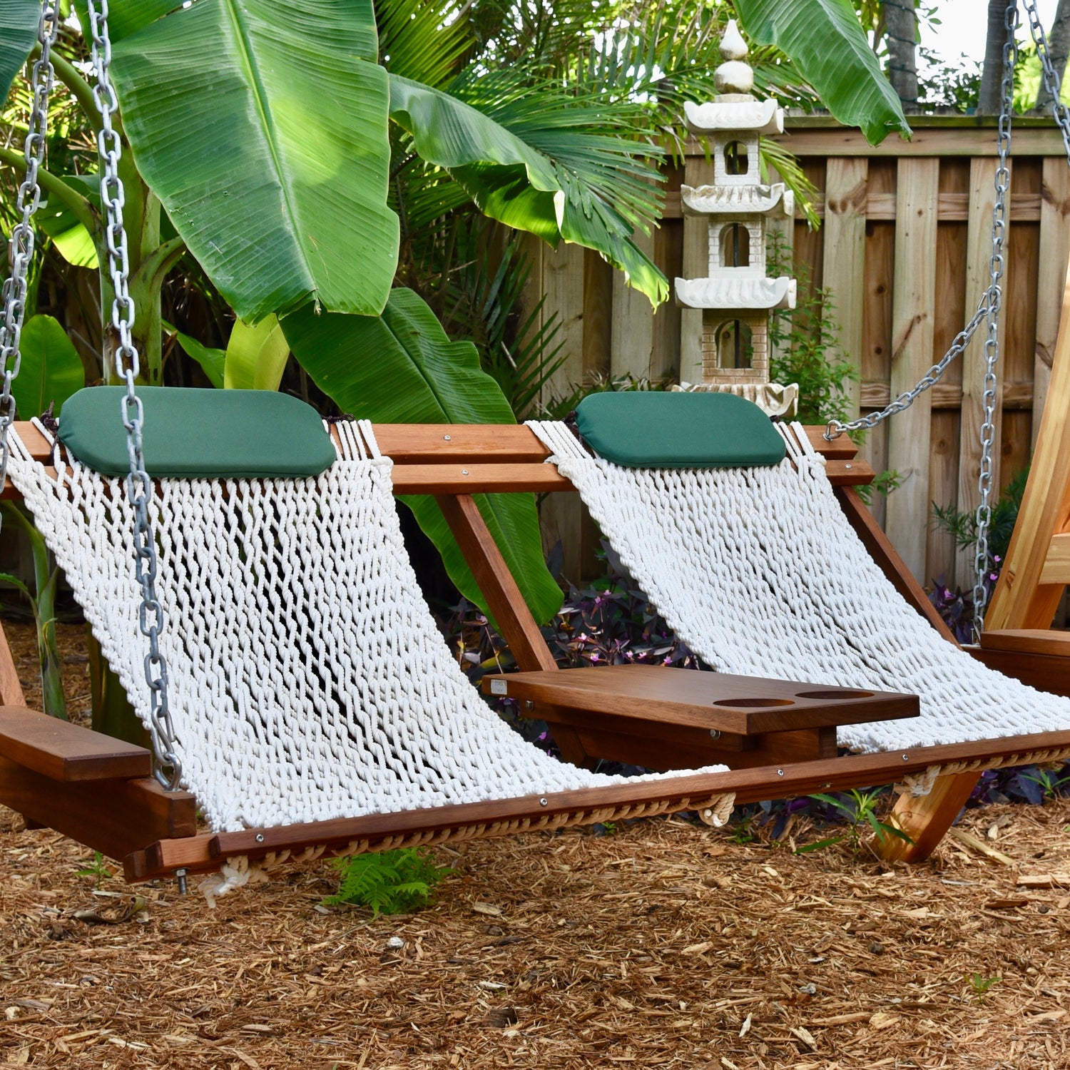 tropical garden in key west with a porch swing hammock