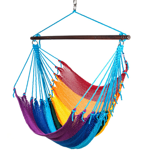 Jumbo Caribbean Hammock Chair in rainbow, hand-woven polyester cord with light blue end cords and a dark hardwood spreader bar, on a white background
