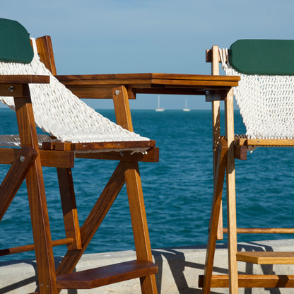 two wood bar stools with rope seats in key west