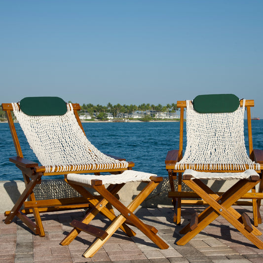 a set of chairs in front of the blue ocean