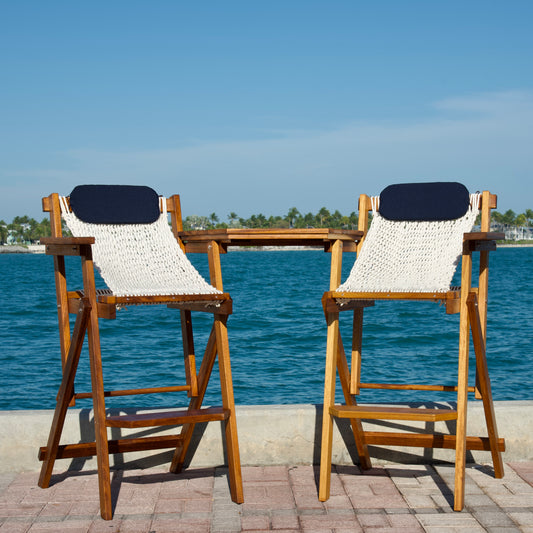 wood bar set on the dock with blue pillows and iroko wood