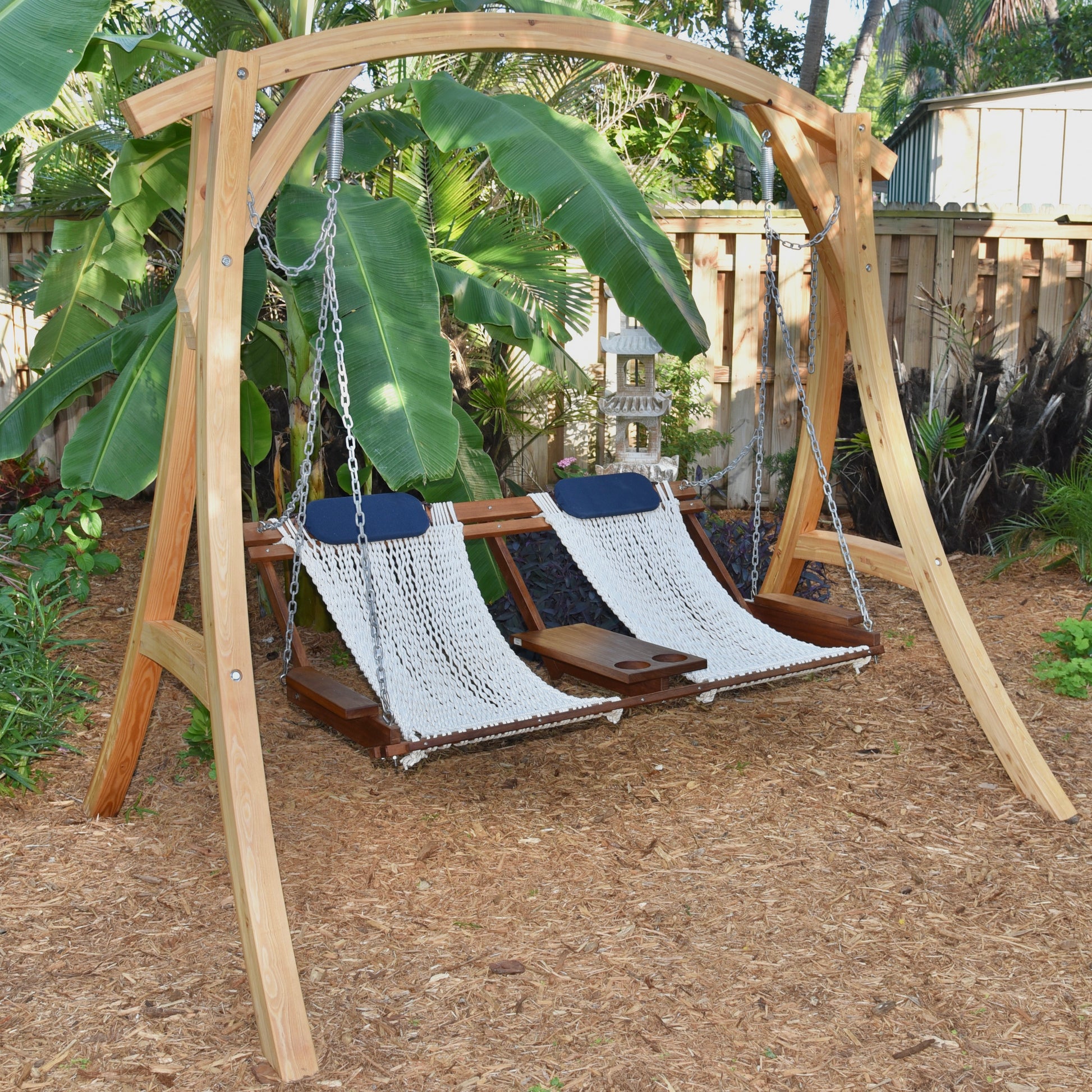 unique looking porch swing in a tropical garden