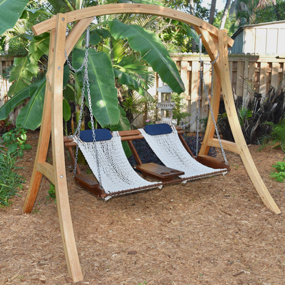 unique looking porch swing in a tropical garden