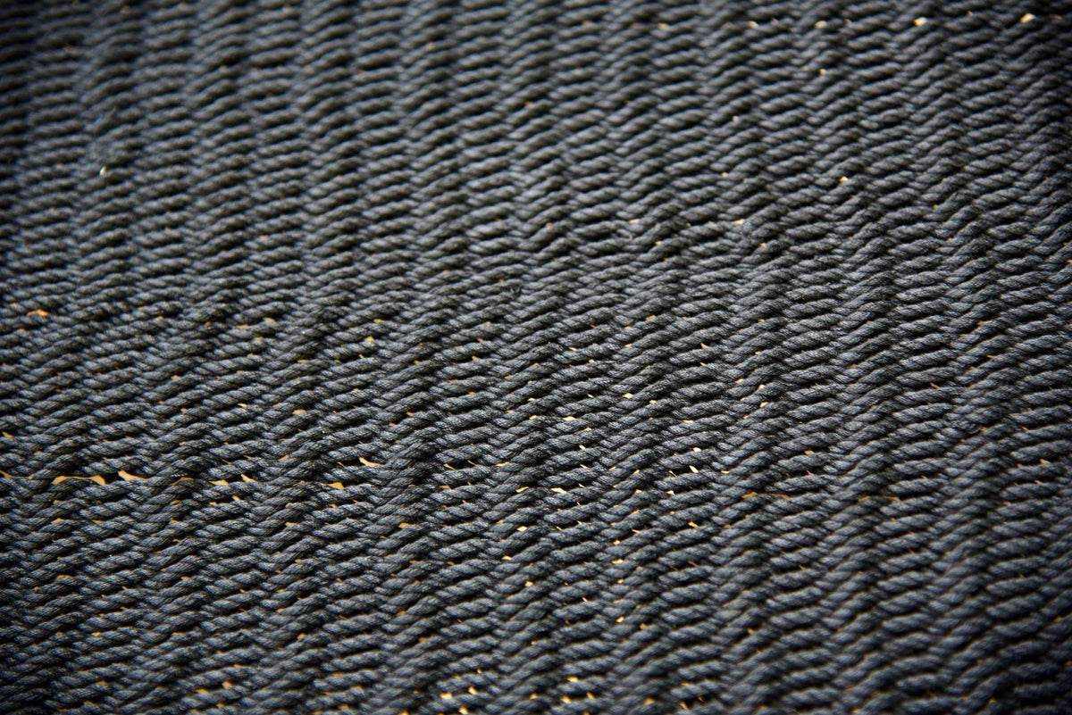 Close-up of the micro-weave polyester bed of the Black Double Caribbean Hammock