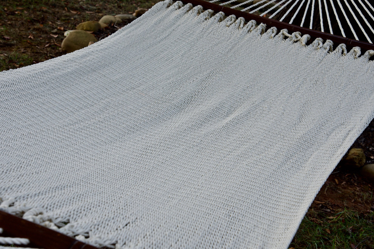 The full hand-woven bed of the Cream Double Caribbean Hammock seen end to end