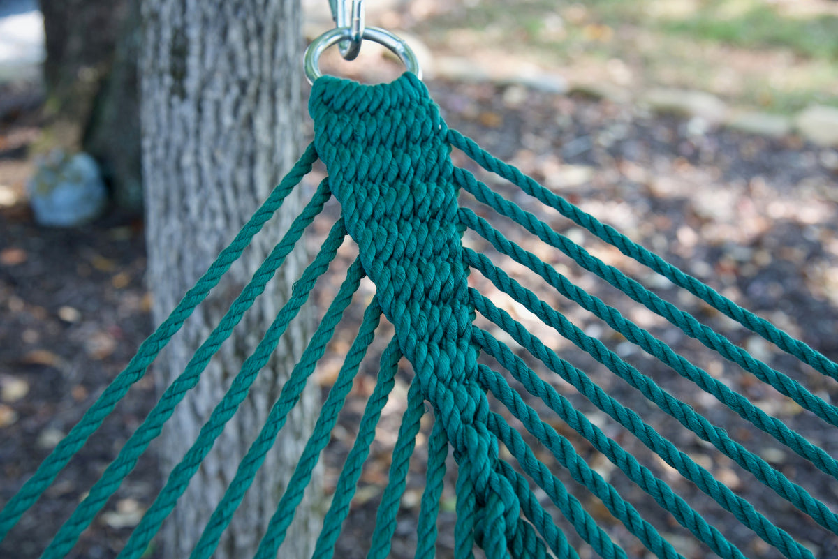 Clew knot on a Green Double Caribbean Hammock, polyester cords gathered into a stainless steel O-ring