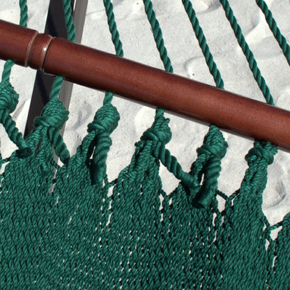 Close-up of the varnished hardwood spreader bar and end cords on the Green Double Caribbean Hammock