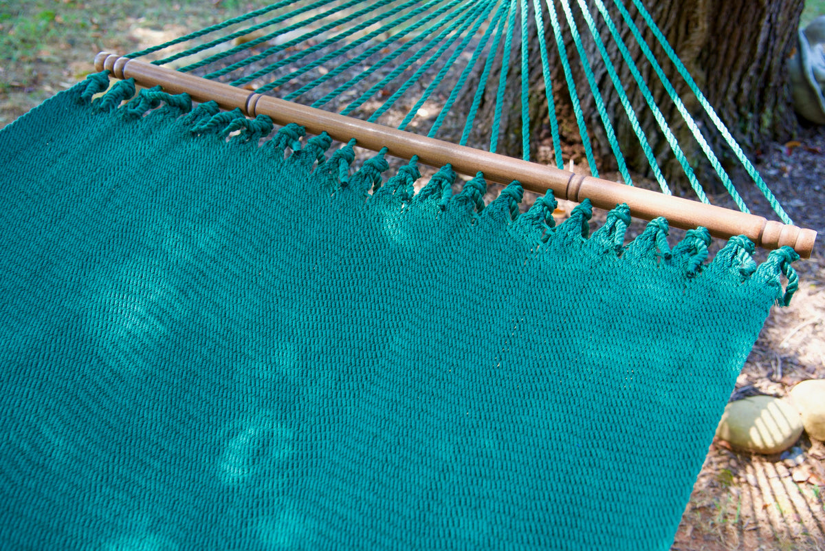 Hardwood spreader bar and fanned end cords on the Green Double Caribbean Hammock