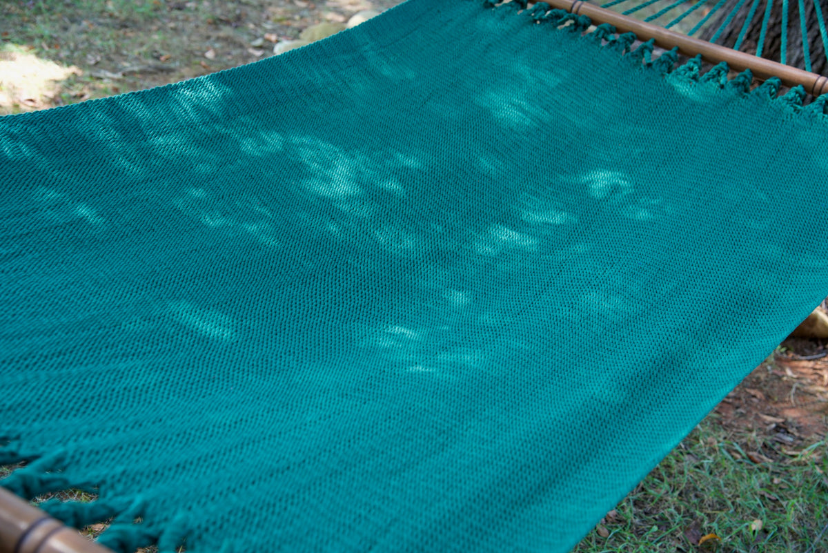 The full hand-woven bed of the Green Double Caribbean Hammock seen end to end