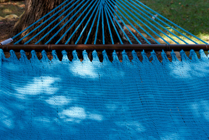 End cords fanning above the hardwood spreader bar of the Light Blue Double Caribbean Hammock