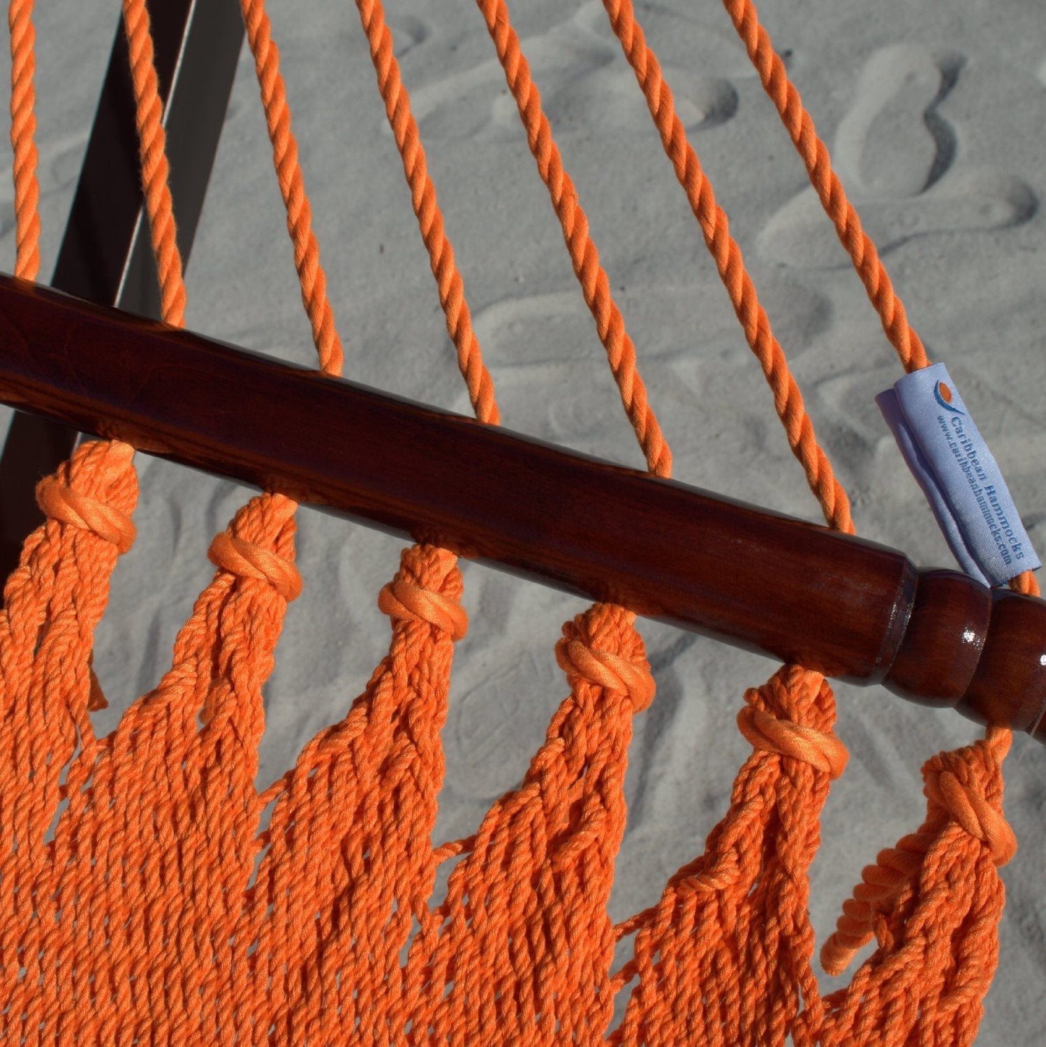 Close-up of the Caribbean Hammocks label on the end cords of the Orange Double Caribbean Hammock