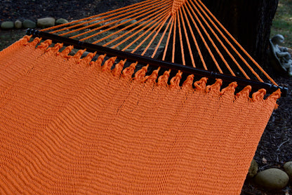 Hardwood spreader bar and fanned end cords on the Orange Double Caribbean Hammock