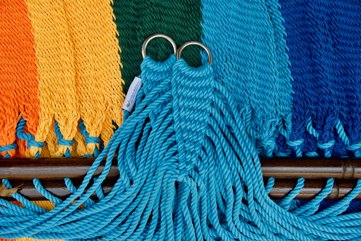 Stainless steel hanging rings, light blue end cords, and clew knot on a Rainbow Double Caribbean Hammock