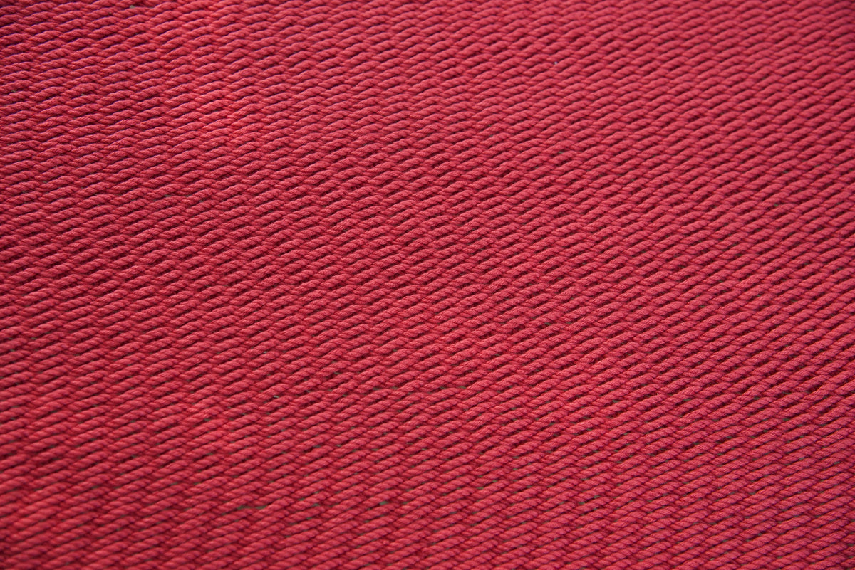 Close-up of the micro-weave polyester bed of the Red Double Caribbean Hammock