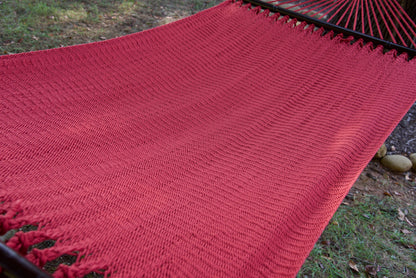 The full hand-woven bed of the Red Double Caribbean Hammock seen end to end