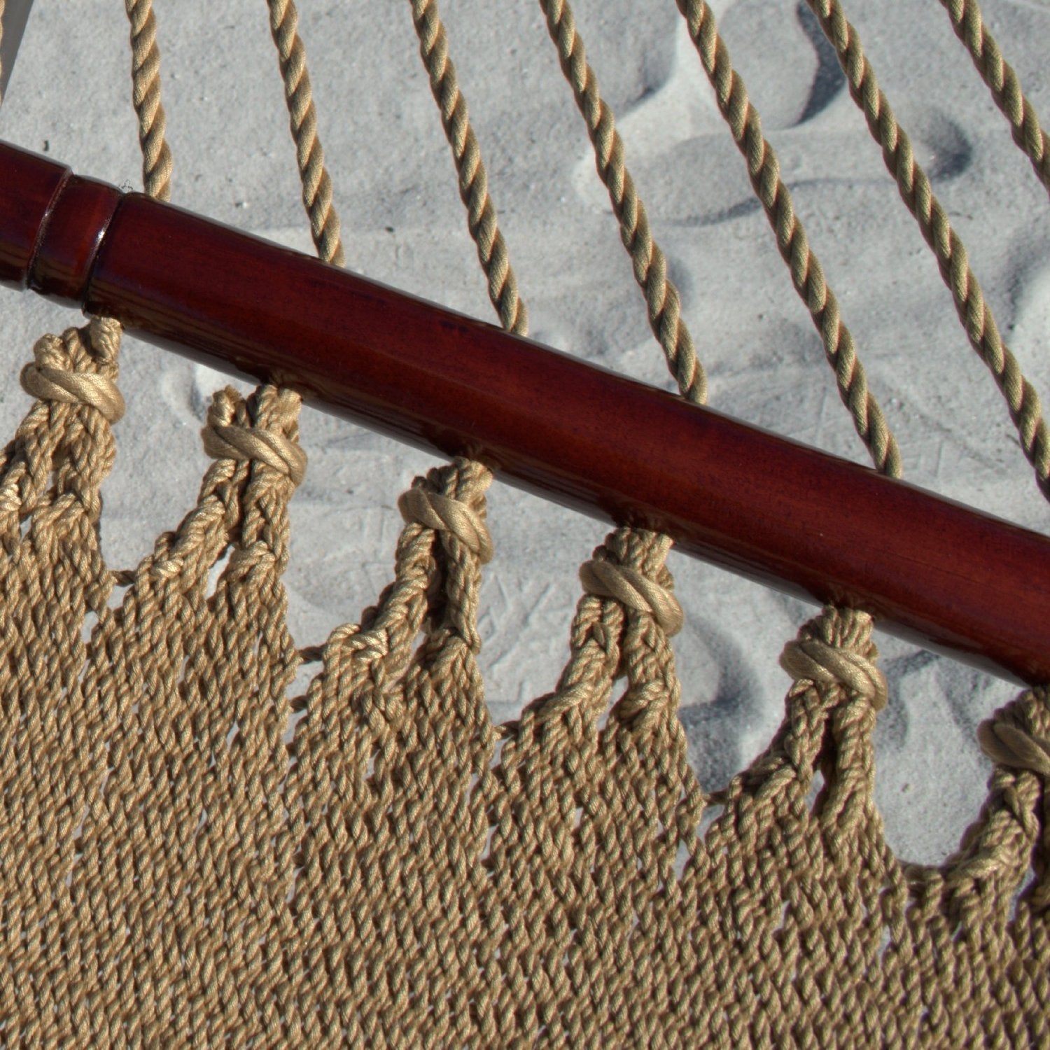 Close-up of the varnished hardwood spreader bar and end cords on the Tan Double Caribbean Hammock