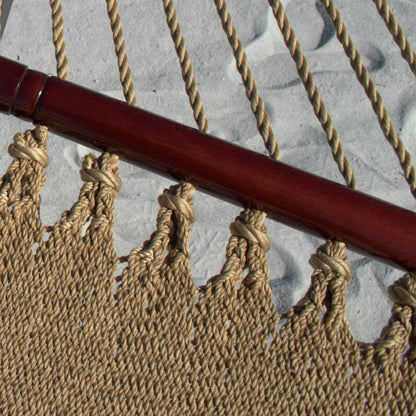 Close-up of the varnished hardwood spreader bar and end cords on the Tan Double Caribbean Hammock