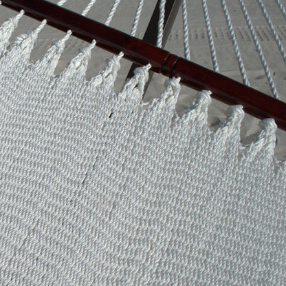 Close-up of the varnished hardwood spreader bar and end cords on the White Double Caribbean Hammock