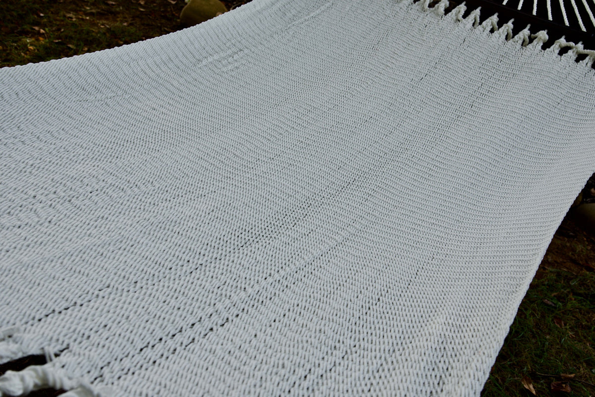 The full hand-woven bed of the White Double Caribbean Hammock seen end to end