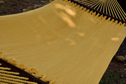 The full hand-woven bed of the Yellow Double Caribbean Hammock seen end to end