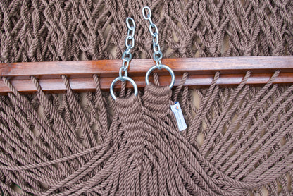 Clew knot on a mocha Island Escape hammock, polyester cords gathered into stainless steel rings with hanging chain and Caribbean Hammocks label