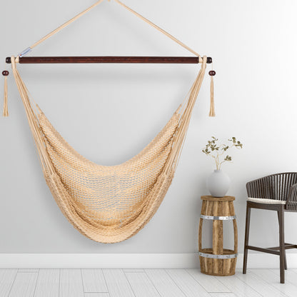 Cream Island Haven hammock chair hanging beside a barrel side table and bar stool against a pale grey wall