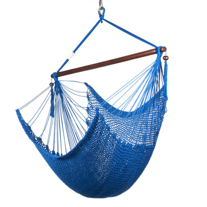Island Haven hammock chair in dark blue, hand-woven poly cord with a dark hardwood spreader bar and tasseled ends, on a white background