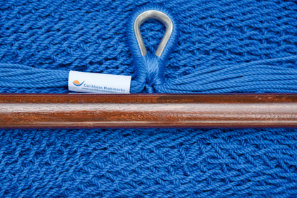 Close-up of the sewn brand label and zinc-plated ring at the seat edge of a dark blue Island Haven hammock chair
