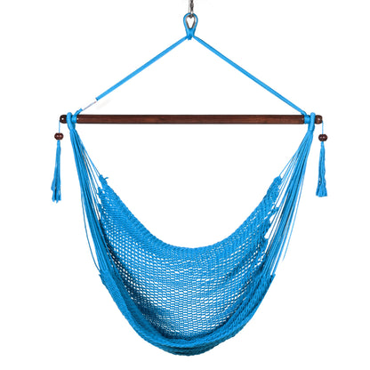Front view of a light blue Island Haven hammock chair showing the deep open-weave seat and built-in footrest, on a white background