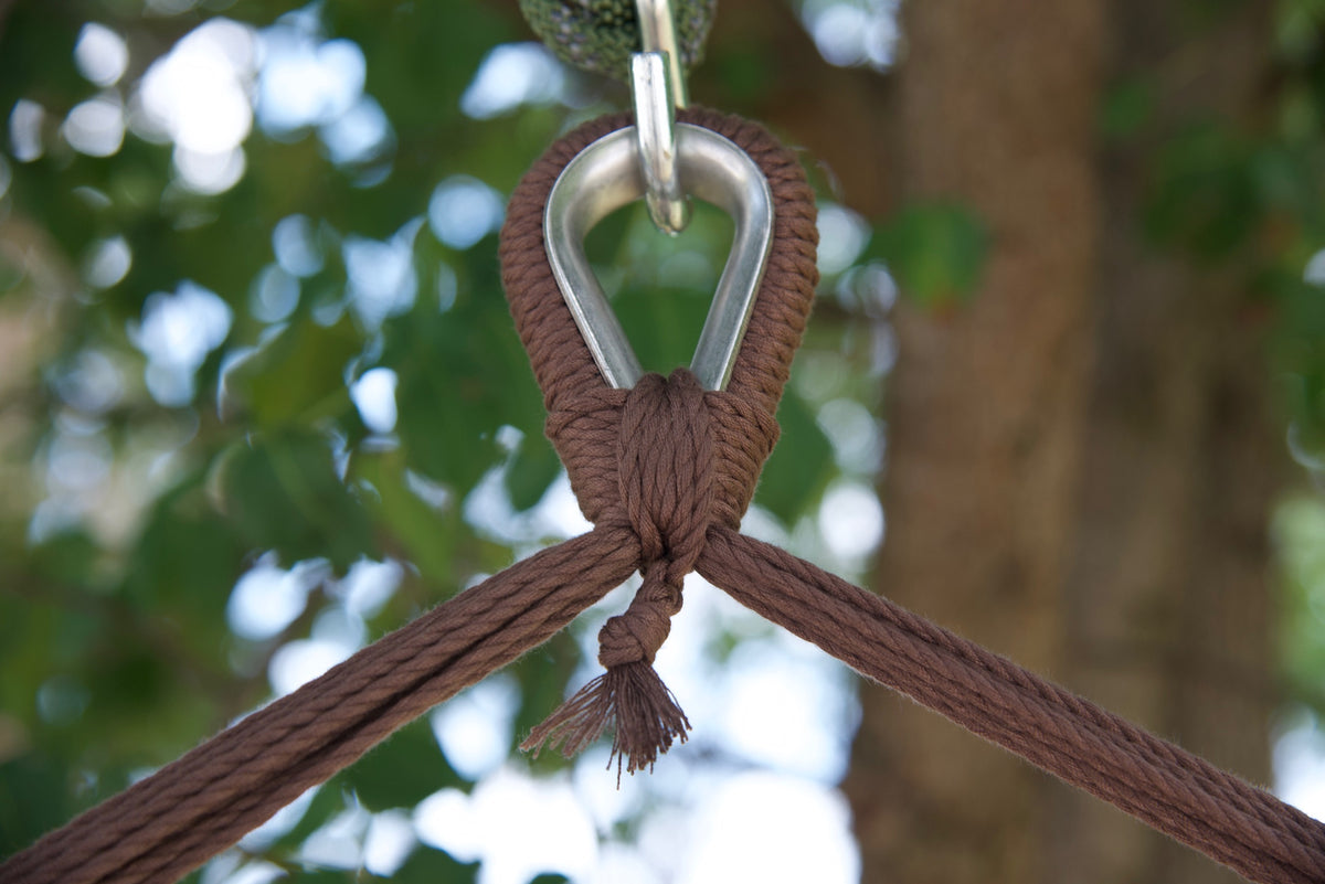 Close-up of the zinc-plated hanging ring where the mocha end cords of an Island Haven hammock chair meet