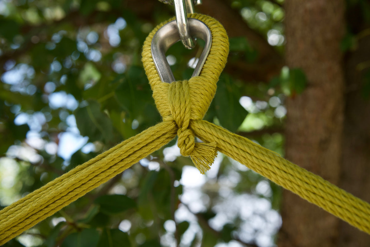 Close-up of the zinc-plated hanging ring where the olive end cords of an Island Haven hammock chair meet