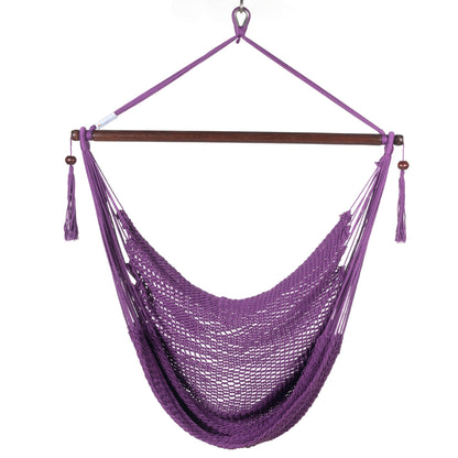 Front view of a purple Island Haven hammock chair showing the deep open-weave seat and built-in footrest, on a white background