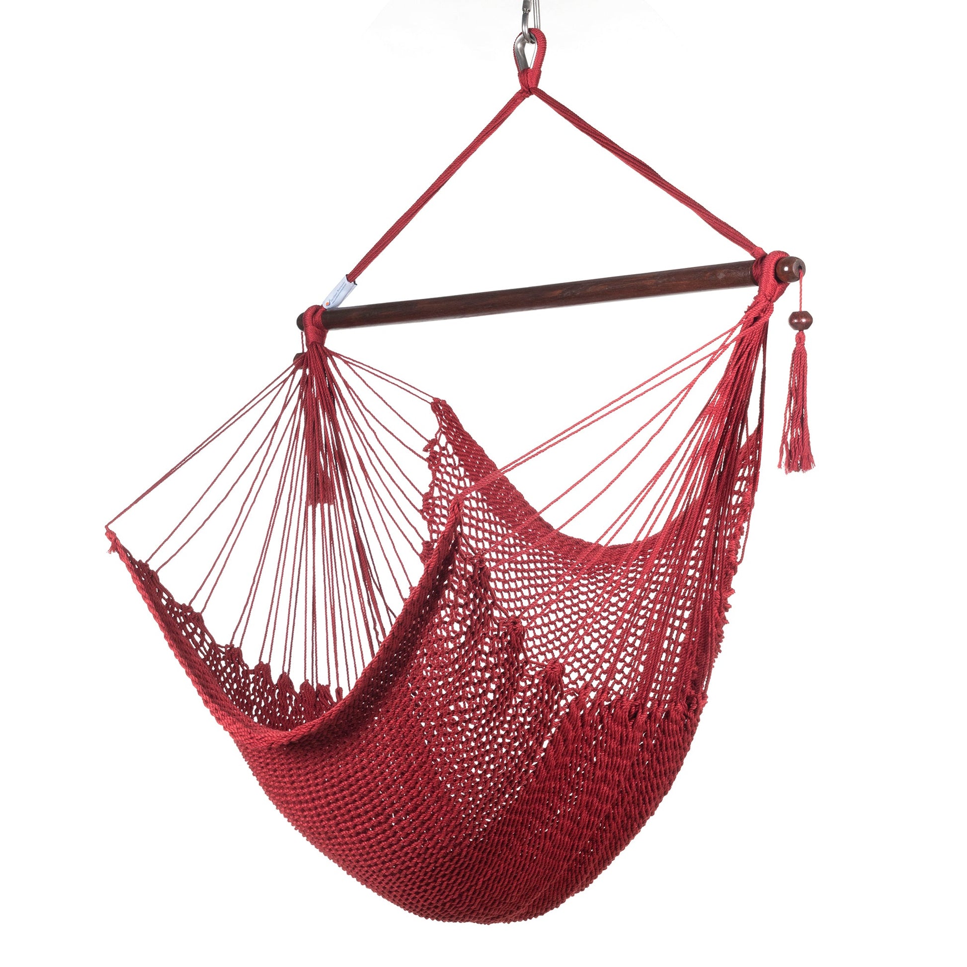 Island Haven hammock chair in red, hand-woven poly cord with a dark hardwood spreader bar and tasseled ends, on a white background