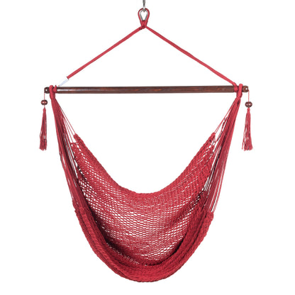 Front view of a red Island Haven hammock chair showing the deep open-weave seat and built-in footrest, on a white background