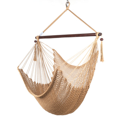 Island Haven hammock chair in tan, hand-woven poly cord with a dark hardwood spreader bar and tasseled ends, on a white background