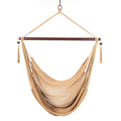 Front view of a tan Island Haven hammock chair showing the deep open-weave seat and built-in footrest, on a white background