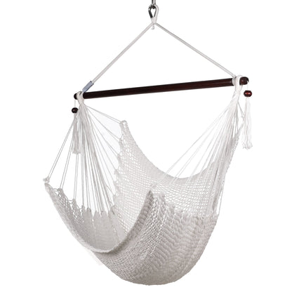 Island Haven hammock chair in white, hand-woven poly cord with a dark hardwood spreader bar and tasseled ends, on a white background