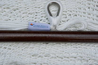 Close-up of the sewn brand label and zinc-plated ring at the seat edge of a white Island Haven hammock chair