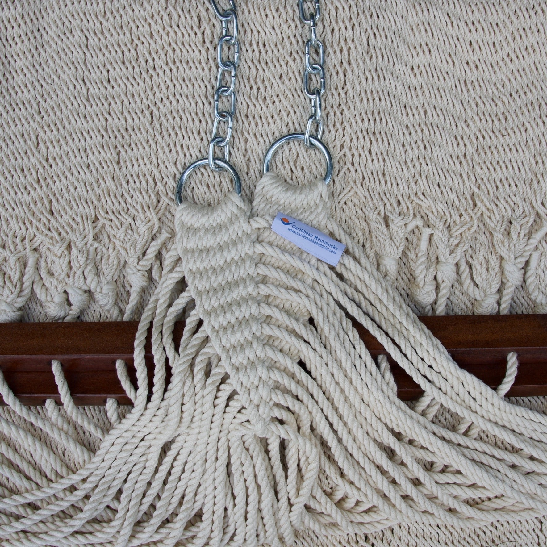 Clew knot on a cream Island Oasis hammock, polyester cords gathered into stainless steel rings with hanging chain