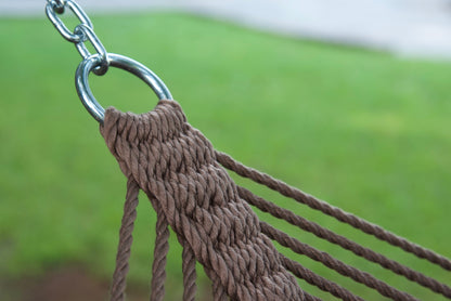 Stainless steel hanging ring, polyester end cords, and clew knot on a mocha Island Oasis hammock, lawn behind