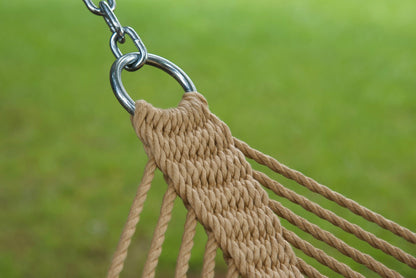Stainless steel hanging ring, polyester end cords, and clew knot on a tan Island Oasis hammock, lawn behind
