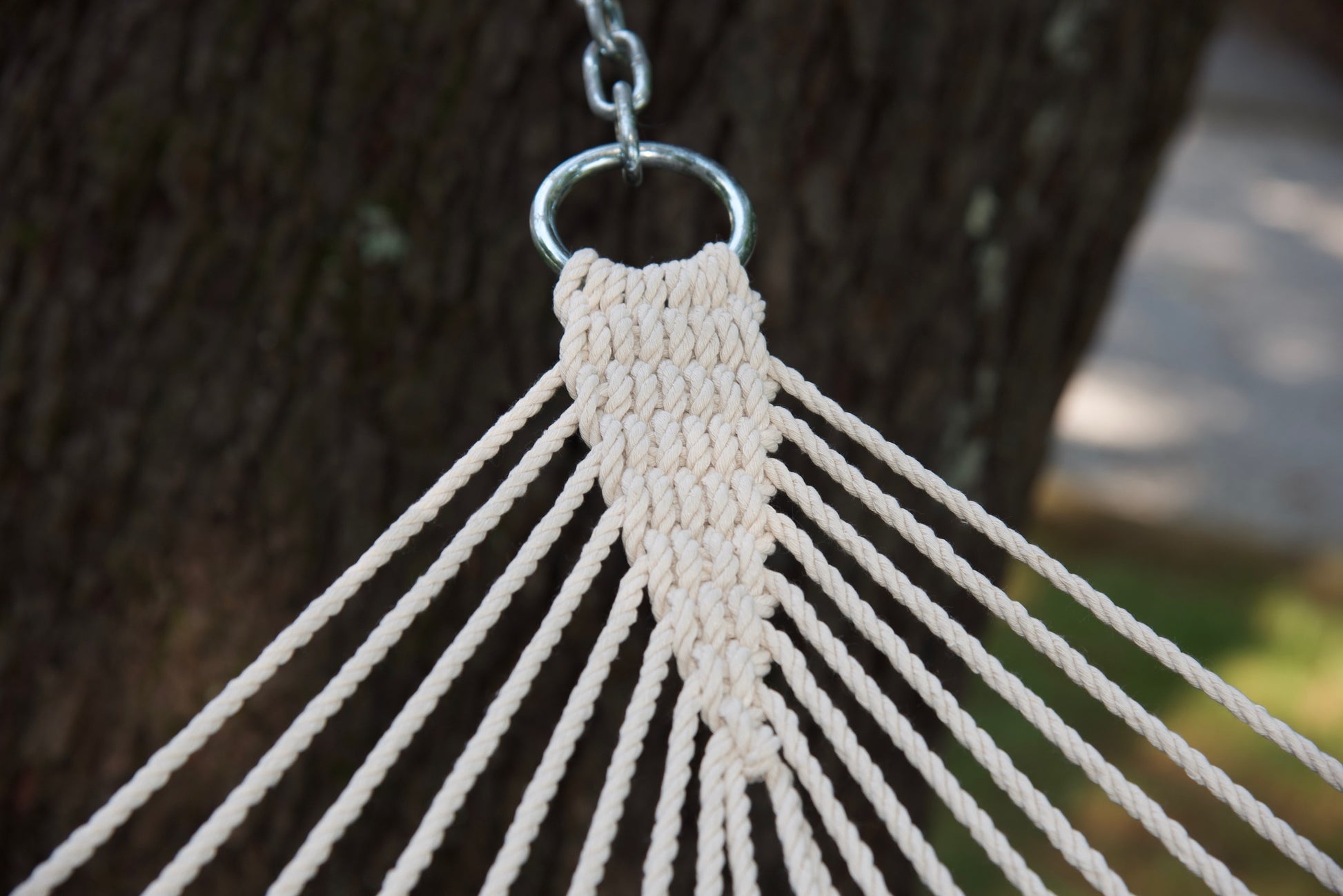 Clew knot on an Island Tranquility hammock, polyester end cords gathered into a zinc-plated O-ring and chain