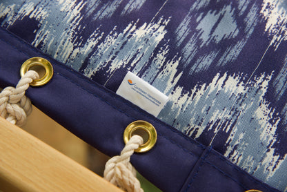 Caribbean Hammocks label and brass roll-rimmed grommets on the reinforced edge of a blue wave Island Tranquility hammock