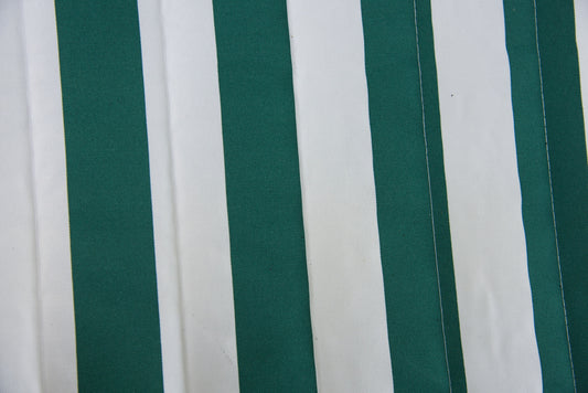 Close-up of the green stripe Jacquard-woven polyester bed on an Island Tranquility hammock, showing lock-stitch quilting