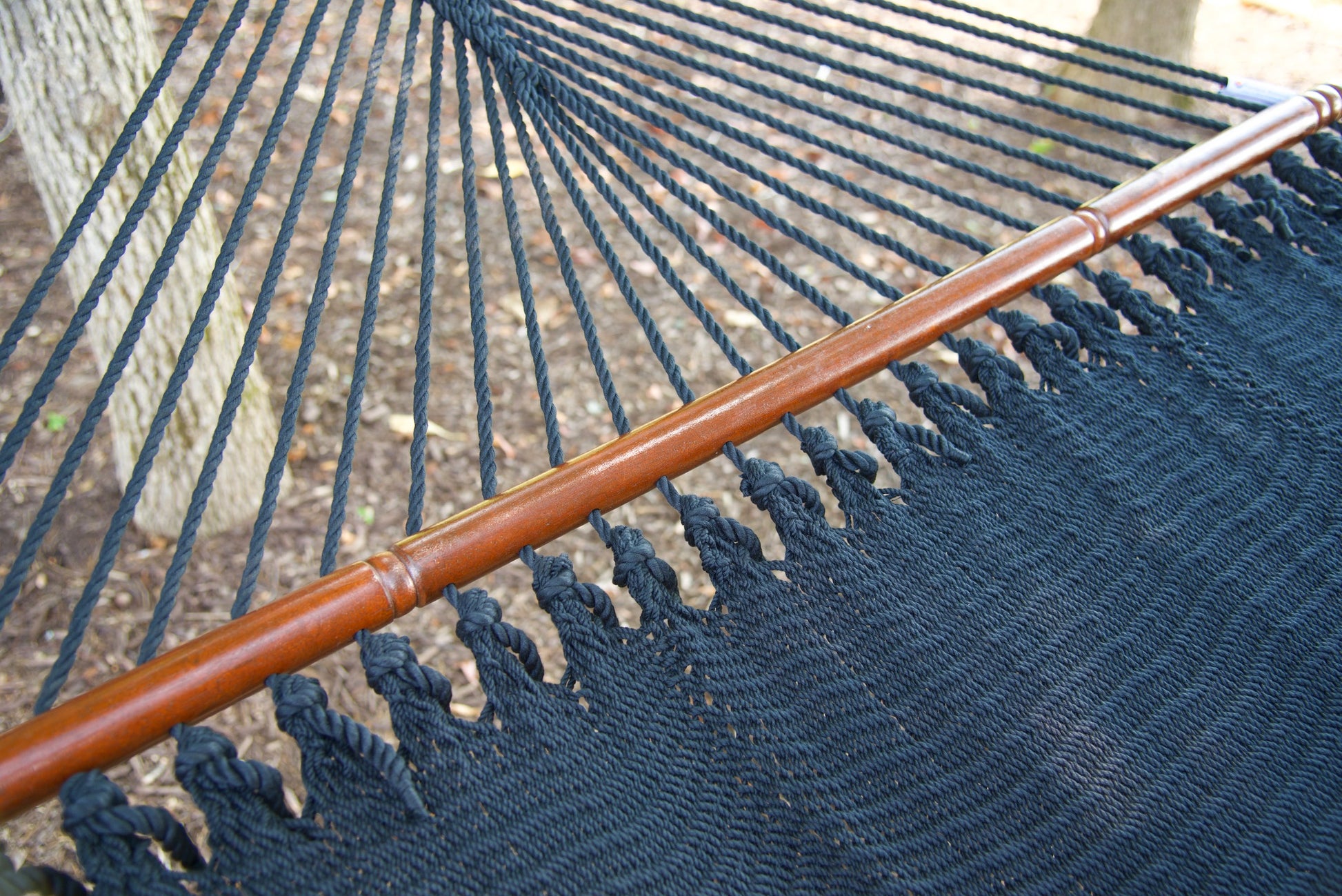 Close-up of the knotted edge loops joining the end cords to the bed of the Black Jumbo Caribbean Hammock