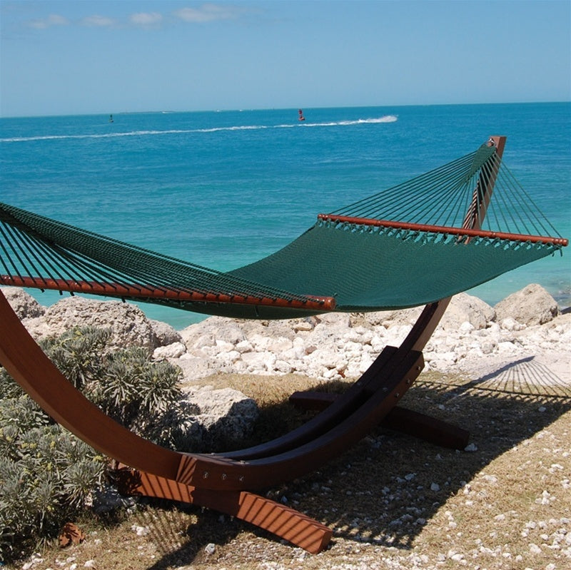 Green Jumbo Caribbean Hammock hanging on the Wood Arc Hammock Stand