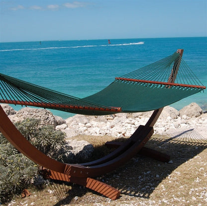 Green Jumbo Caribbean Hammock hanging on the Wood Arc Hammock Stand