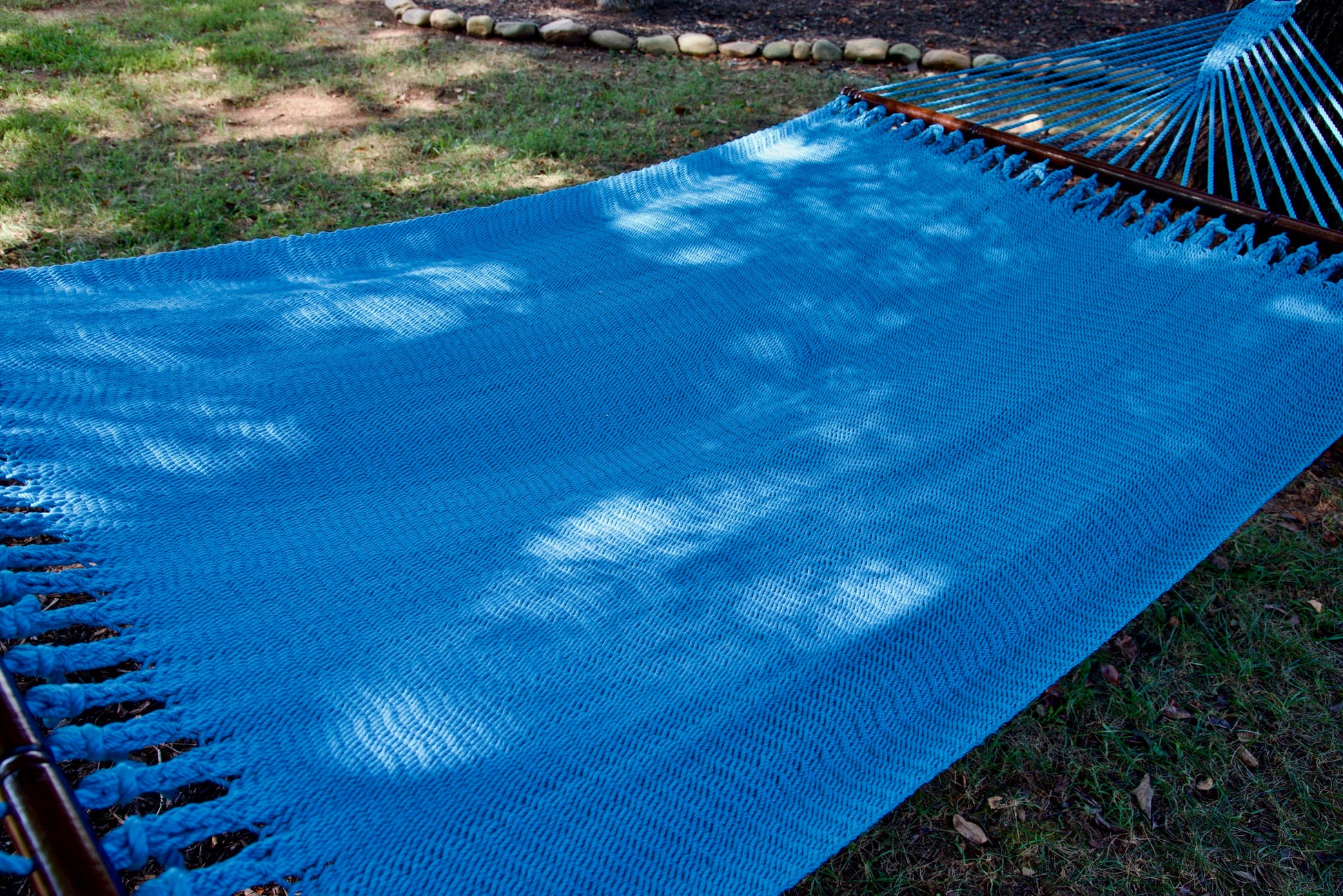 The full hand-woven bed of the Light Blue Jumbo Caribbean Hammock seen end to end