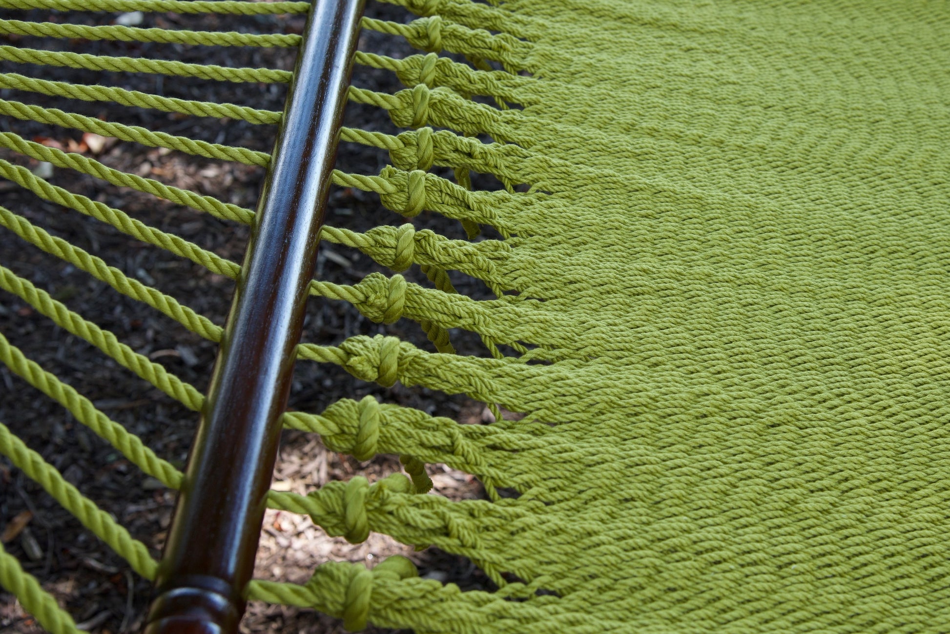 Macro view of the knotted edge loops at the spreader bar of the Olive Jumbo Caribbean Hammock
